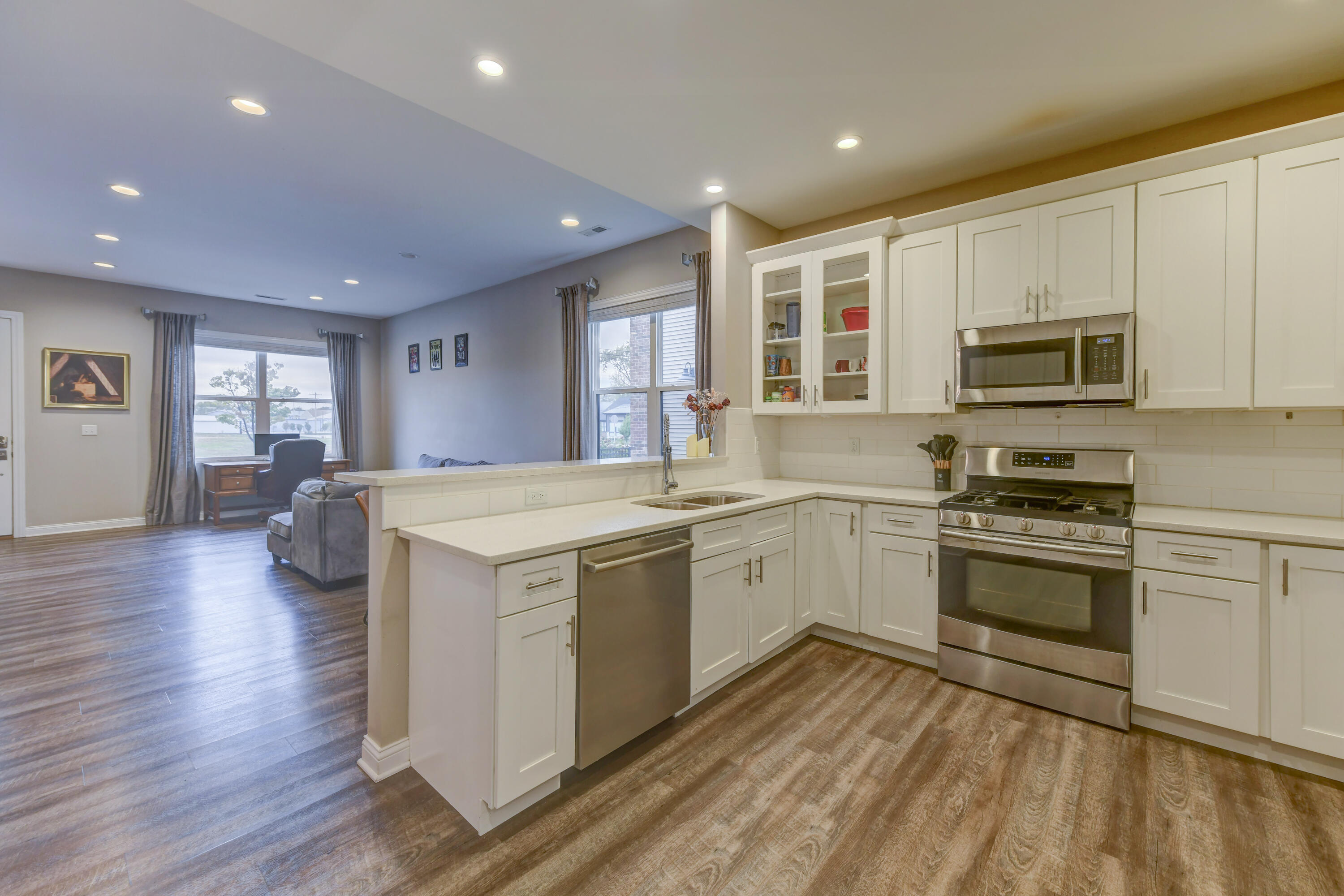 360 North Indiana Avenue Crown Point, IN 46307 - Photo 5 of 22 a kitchen with a stove sink and a microwave