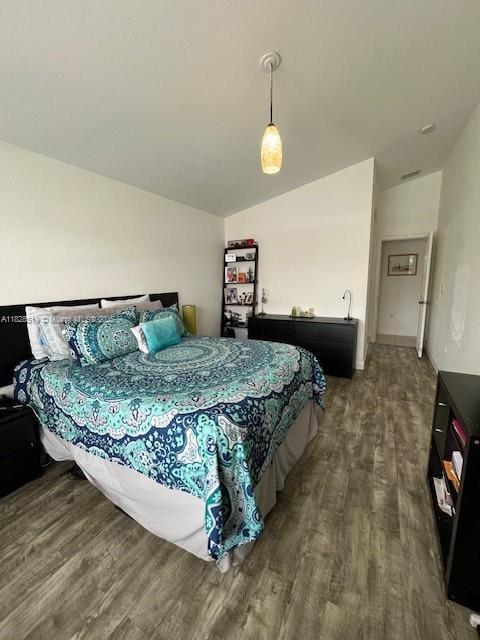 1988 Southeast 12th Street Homestead, FL 33035 - Photo 11 of 44 a bedroom with a bed and wooden floor