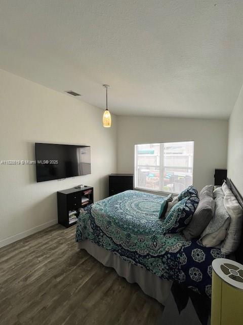 1988 Southeast 12th Street Homestead, FL 33035 - Photo 12 of 44 a bedroom with a bed and a television