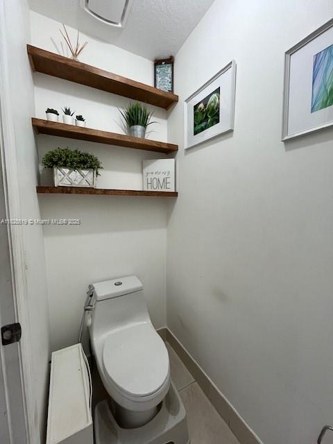 1988 Southeast 12th Street Homestead, FL 33035 - Photo 14 of 44 a bathroom with a toilet and a sink