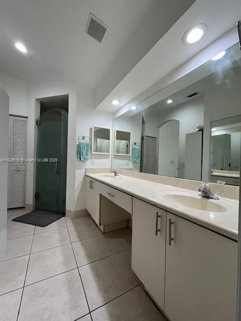 1988 Southeast 12th Street Homestead, FL 33035 - Photo 15 of 44 a large bathroom with a double vanity sink and a mirror