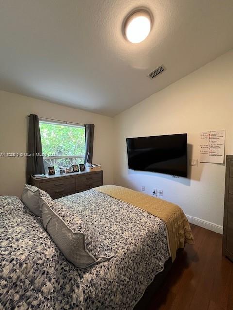 1988 Southeast 12th Street Homestead, FL 33035 - Photo 16 of 44 a bedroom with a bed and a flat screen tv