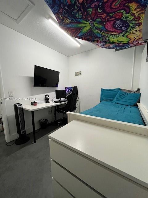 1988 Southeast 12th Street Homestead, FL 33035 - Photo 22 of 44 a bedroom with a bed and a flat screen tv