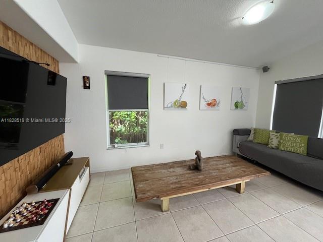 1988 Southeast 12th Street Homestead, FL 33035 - Photo 24 of 44 a living room with furniture and a flat screen tv