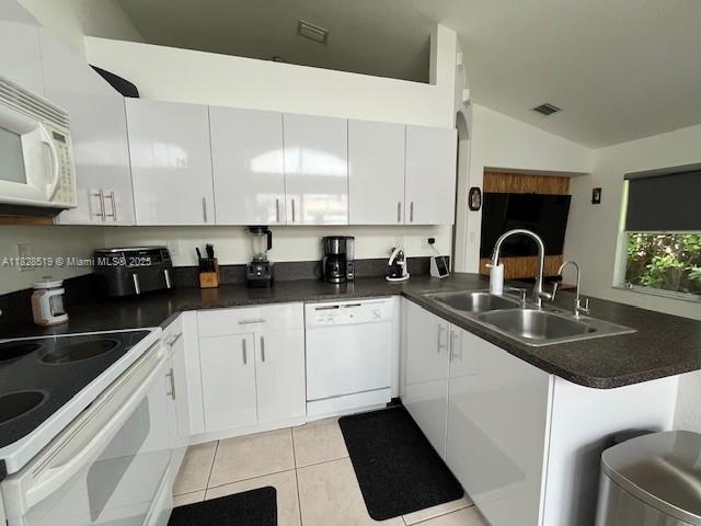 1988 Southeast 12th Street Homestead, FL 33035 - Photo 27 of 44 a kitchen with a sink stove and cabinets