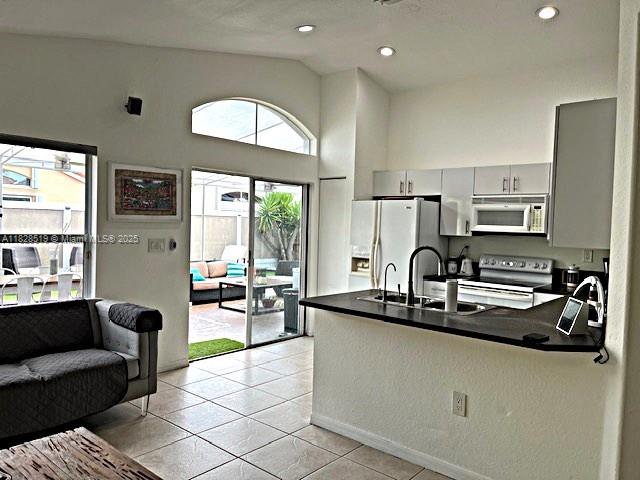 1988 Southeast 12th Street Homestead, FL 33035 - Photo 29 of 44 a kitchen with stainless steel appliances granite countertop a sink a stove and a refrigerator