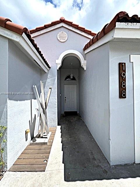 1988 Southeast 12th Street Homestead, FL 33035 - Photo 3 of 44 a view of a house with wooden fence