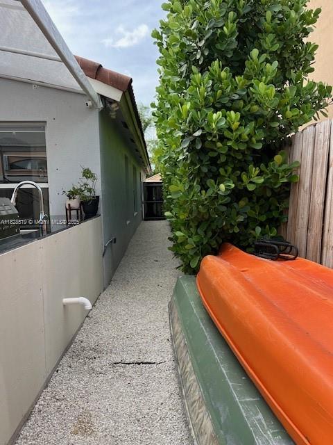 1988 Southeast 12th Street Homestead, FL 33035 - Photo 39 of 44 a backyard of a house with table and chairs