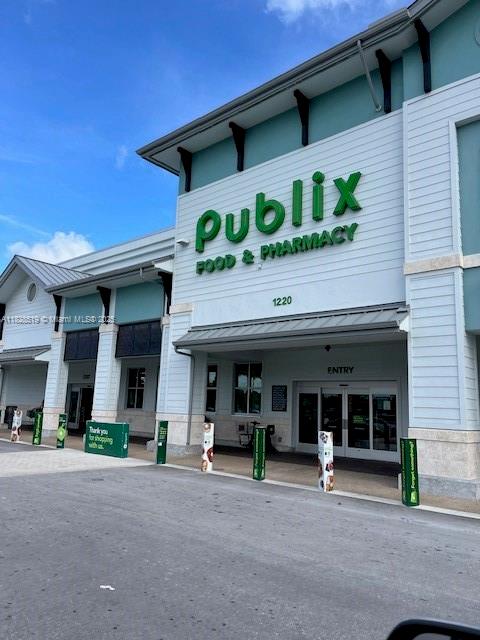 1988 Southeast 12th Street Homestead, FL 33035 - Photo 44 of 44 a front view of a building with porch and outdoor seating