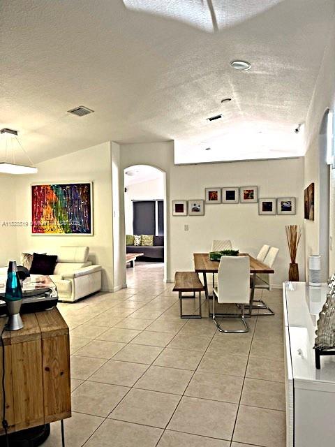 1988 Southeast 12th Street Homestead, FL 33035 - Photo 5 of 44 a living room with couches and kitchen view with wooden floor