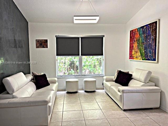 1988 Southeast 12th Street Homestead, FL 33035 - Photo 9 of 44 a living room with furniture and a large window