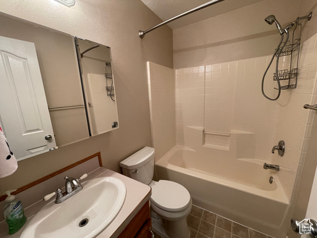 11473 South Dempsey Creek Road Lava Hot Springs, ID 83246 - Photo 16 of 47 Full bathroom featuring washtub / shower combination, vanity, and tile patterned flooring