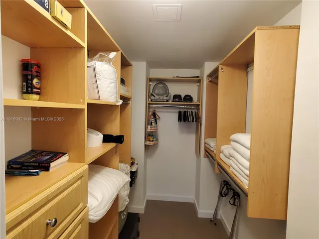 a bedroom with a bed and furniture