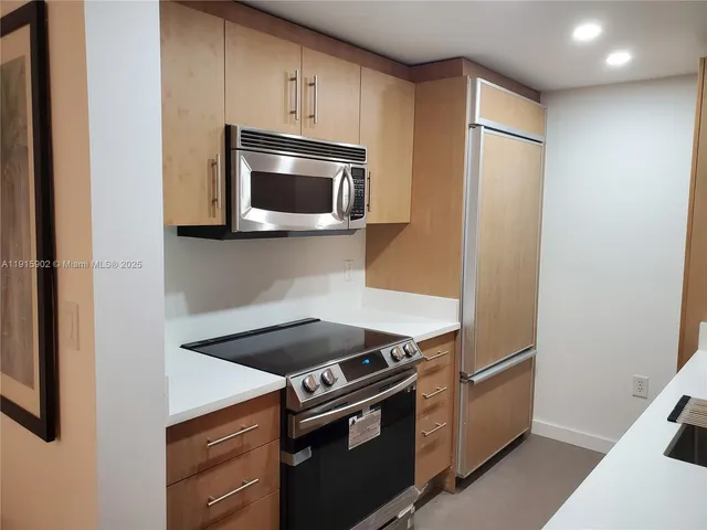 a kitchen with a stove and a microwave