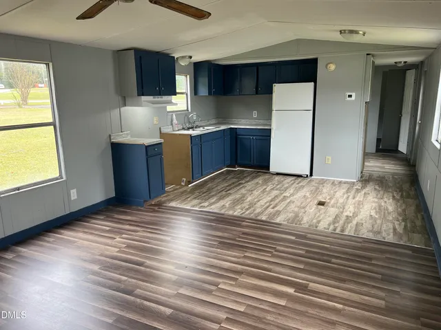 a view of kitchen with wooden floor