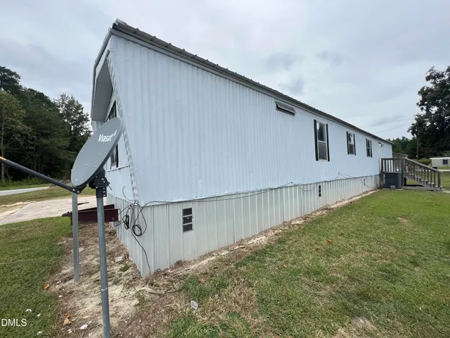 a house with trees in front of it