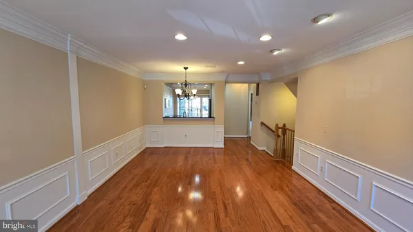 a view of hallway with wooden floor