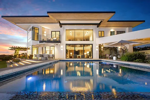 a view of a swimming pool from a balcony