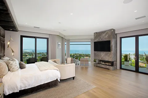 a bathroom with a toilet and a mirror