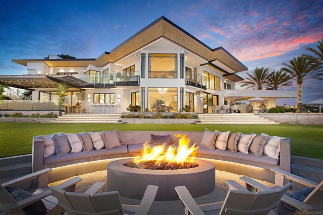 a view of a house with a swimming pool and a couches