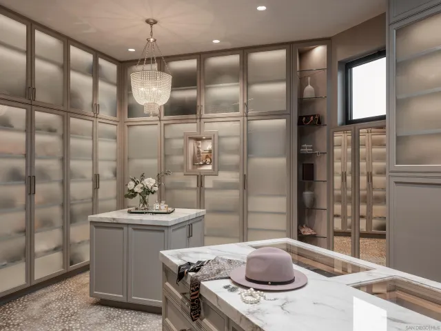 a living room with furniture a chandelier and a dining table