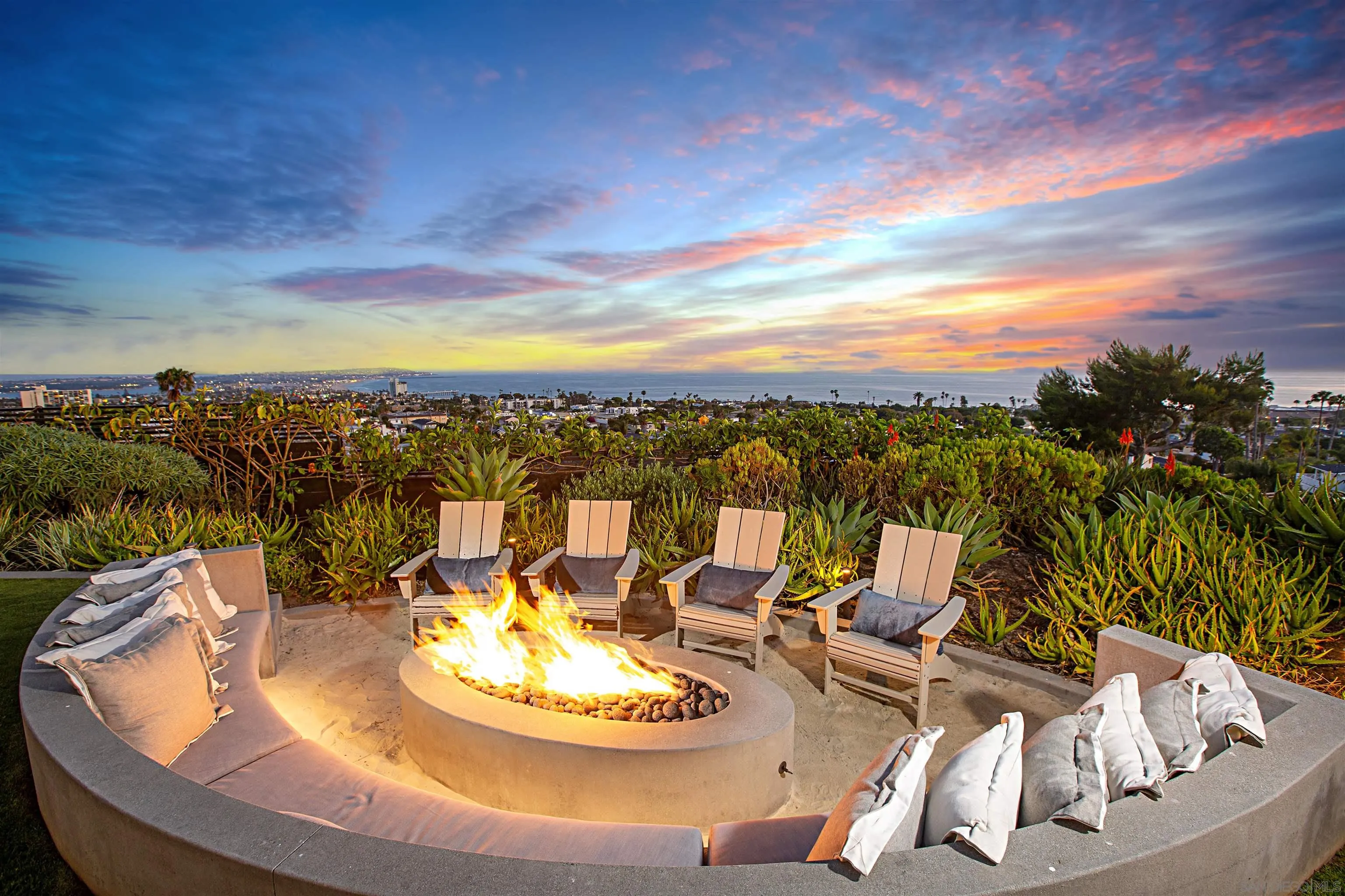 5416 Candlelight Drive La Jolla, CA 92037 - Photo 6 of 75 a view of a swimming pool with a table and chairs