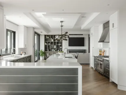 a large bedroom with a bed and large window