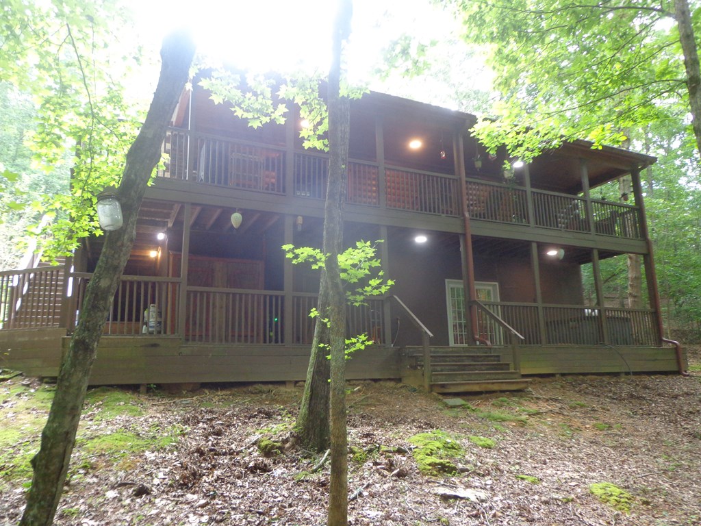 9547 Big Creek Road Ellijay, GA 30536 - Photo 50 of 82 a house view with a garden space