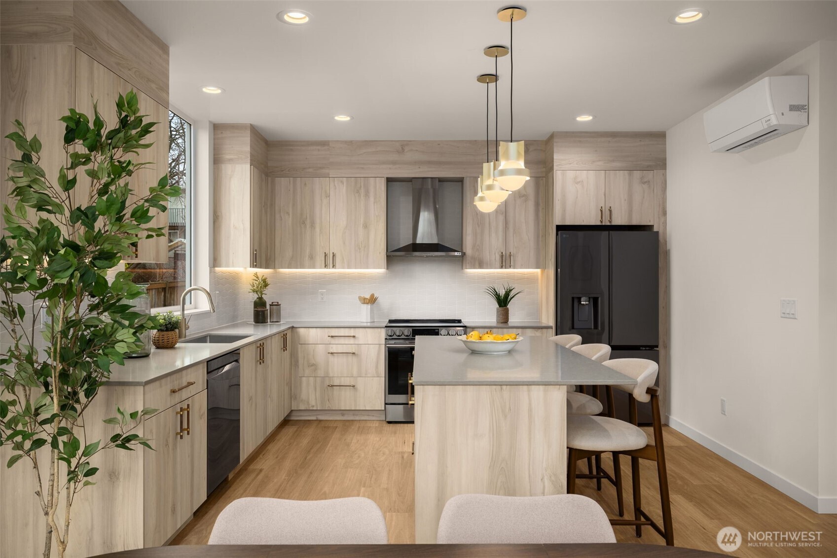 3914 South Juneau Street Seattle, WA 98118 - Photo 11 of 32 a kitchen with a sink stove and refrigerator