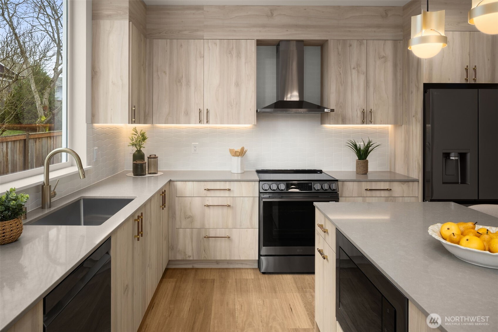 3914 South Juneau Street Seattle, WA 98118 - Photo 16 of 32 a kitchen with a sink stove and refrigerator