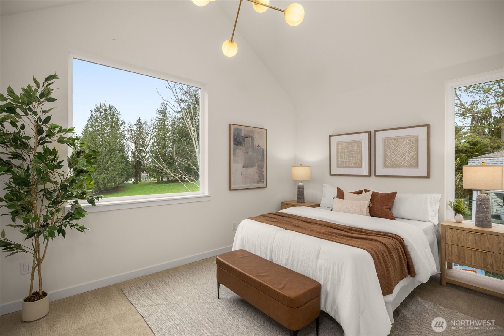 3914 South Juneau Street Seattle, WA 98118 - Photo 20 of 32 a bedroom with a bed lamp and a potted plant