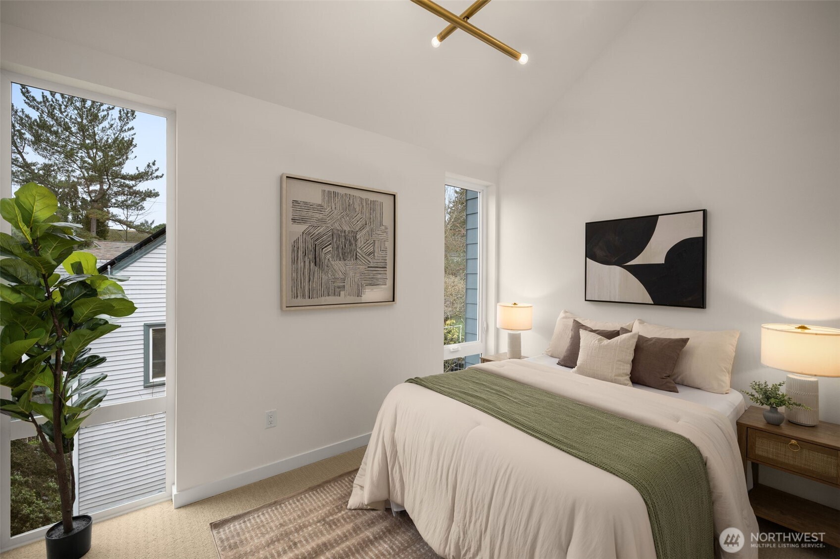 3914 South Juneau Street Seattle, WA 98118 - Photo 26 of 32 a bedroom with a large bed and a potted plant