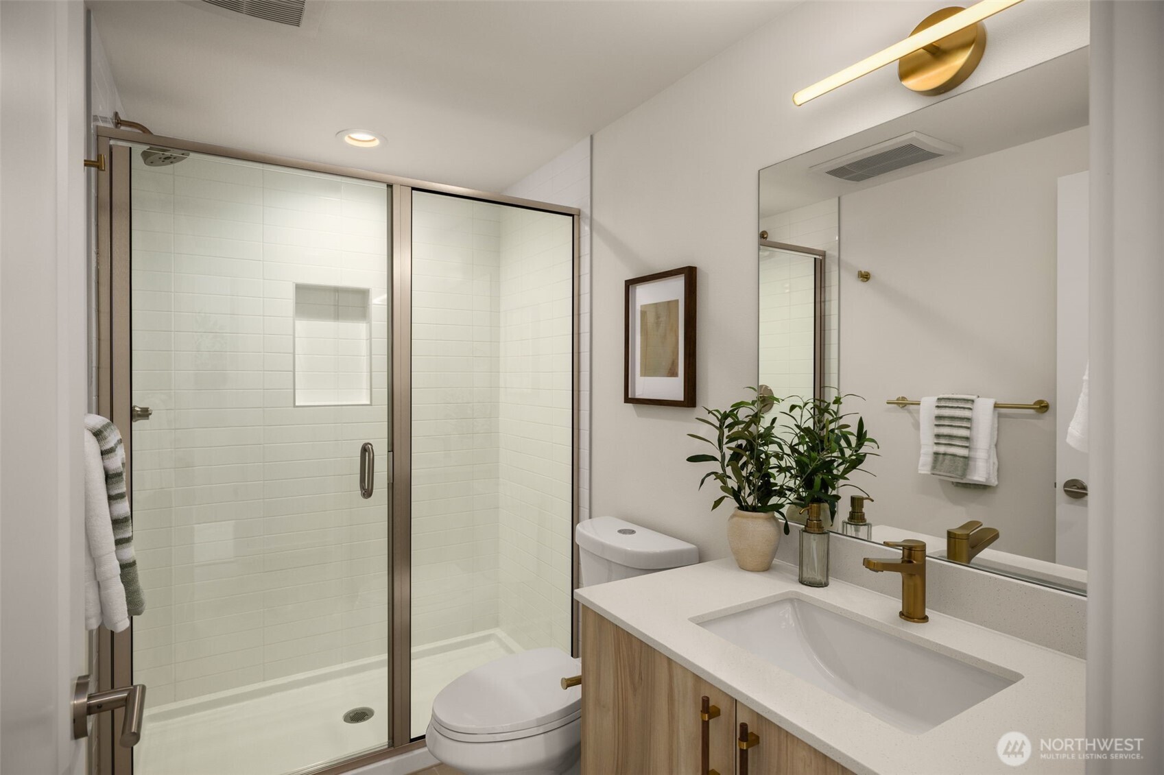 3914 South Juneau Street Seattle, WA 98118 - Photo 27 of 32 a bathroom with a shower sink vanity mirror and toilet
