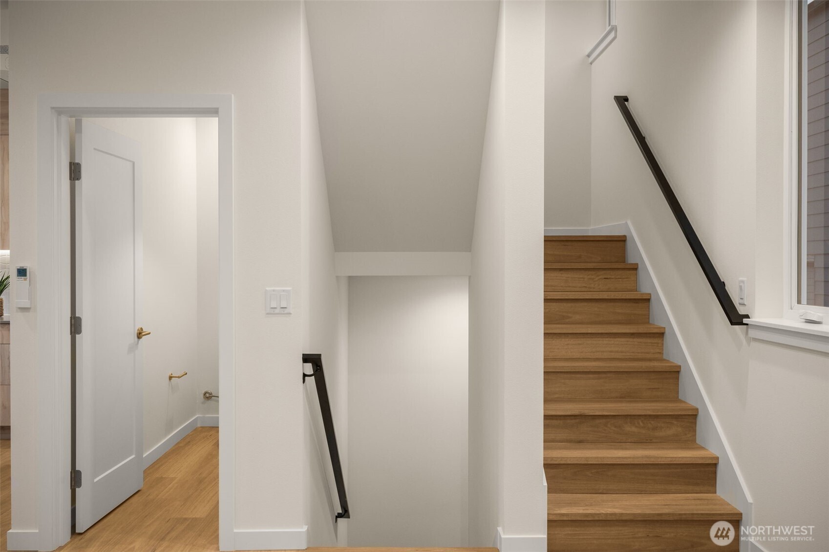 3914 South Juneau Street Seattle, WA 98118 - Photo 6 of 32 a view of staircase with wooden floor and white walls