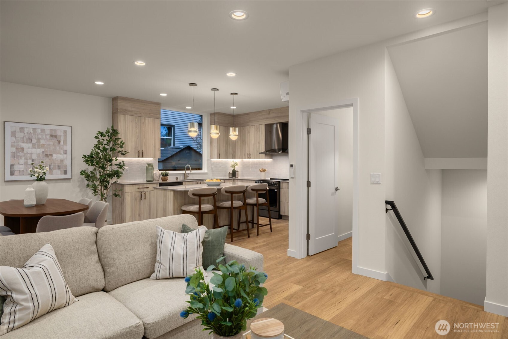 3914 South Juneau Street Seattle, WA 98118 - Photo 8 of 32 a living room with furniture and a dining table with kitchen view