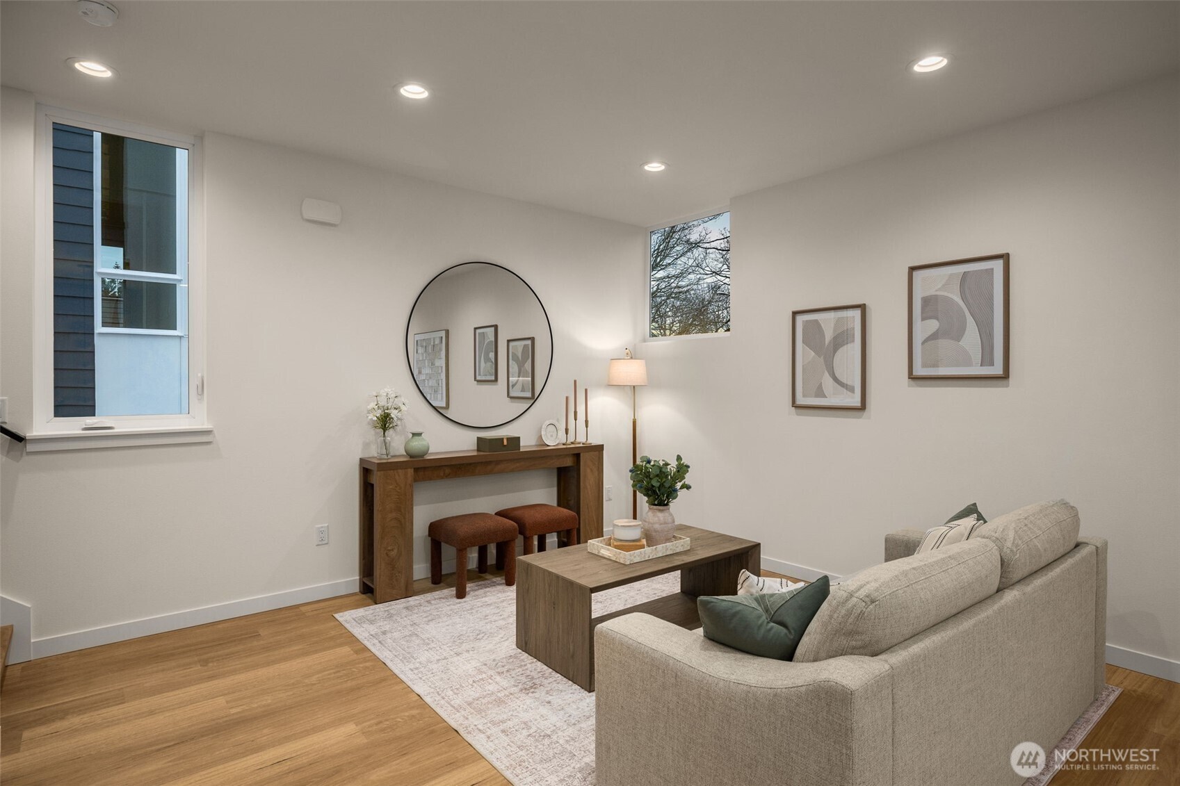 3914 South Juneau Street Seattle, WA 98118 - Photo 9 of 32 a living room with furniture a mirror and a wooden floor