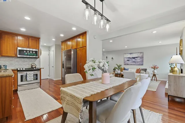a kitchen with a table and chairs in it