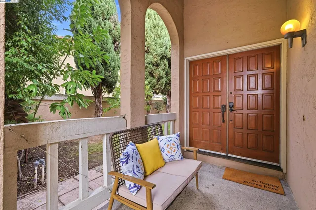 a outdoor living space with furniture and a potted plant