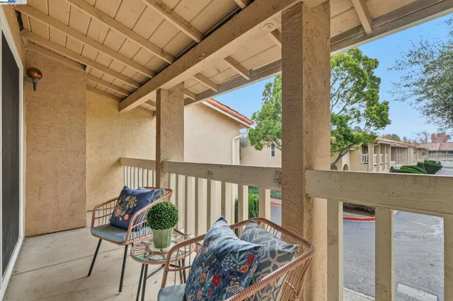 a view of balcony with furniture
