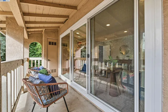 a room with furniture and glass door