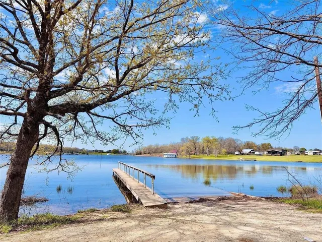 a view of a lake with sitting area