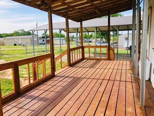 a view of balcony with wooden floor