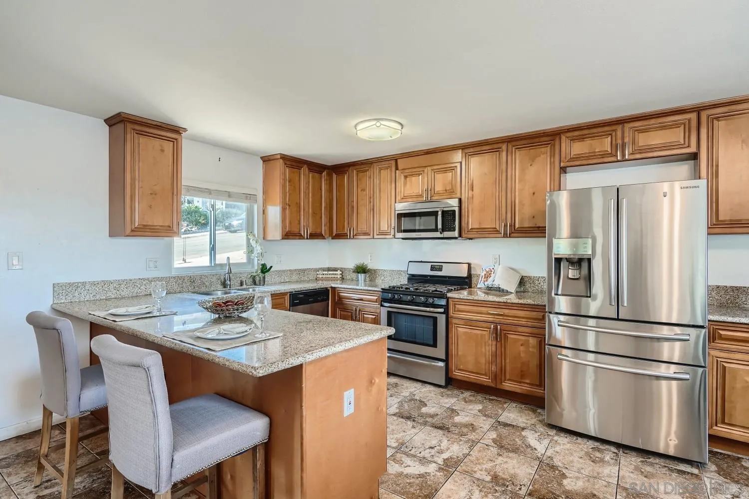 4817 Maple Avenue La Mesa, CA 91942 - Photo 14 of 31 a kitchen with a refrigerator stove top oven and sink
