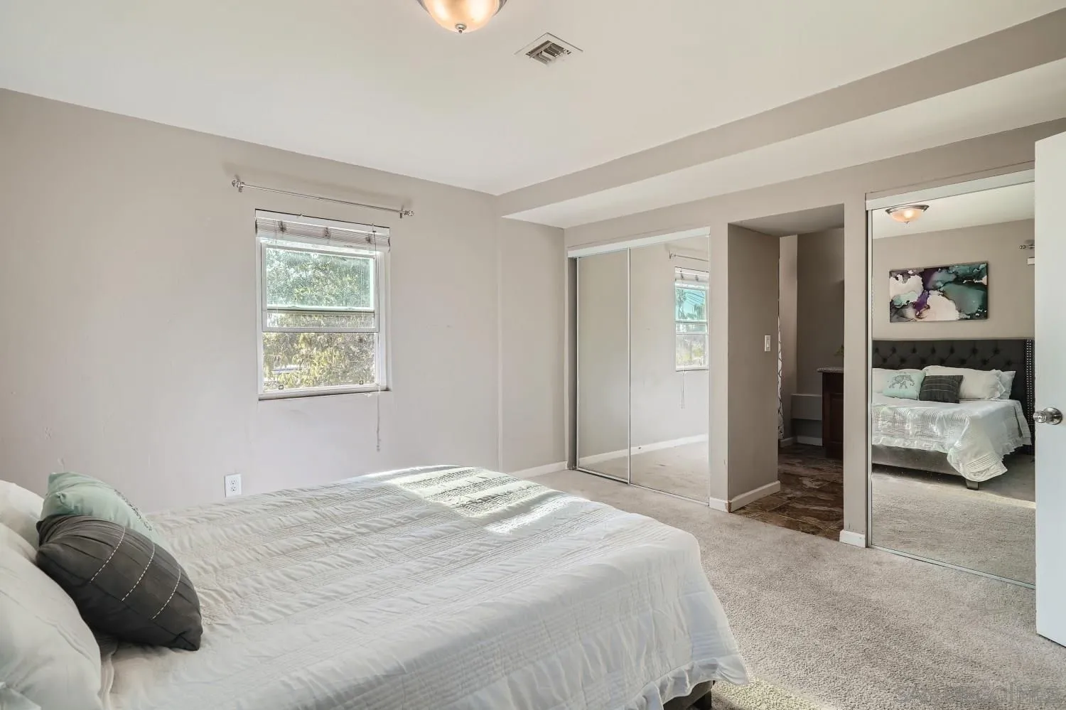 4817 Maple Avenue La Mesa, CA 91942 - Photo 18 of 31 a bedroom with a bed and a window