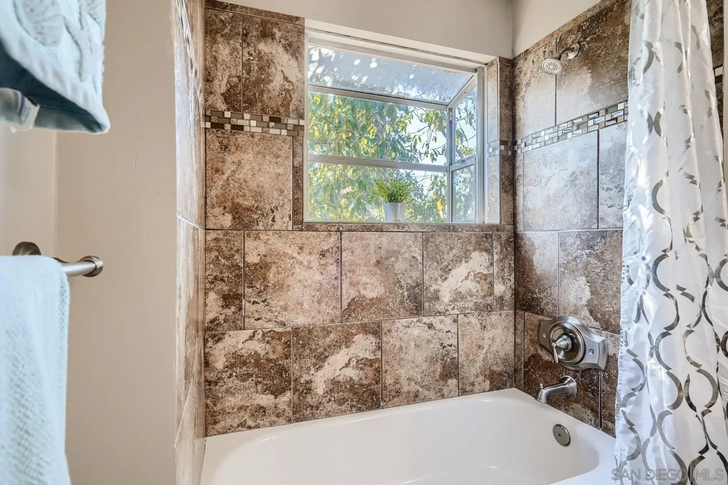4817 Maple Avenue La Mesa, CA 91942 - Photo 20 of 31 a bathroom with a bathtub and shower