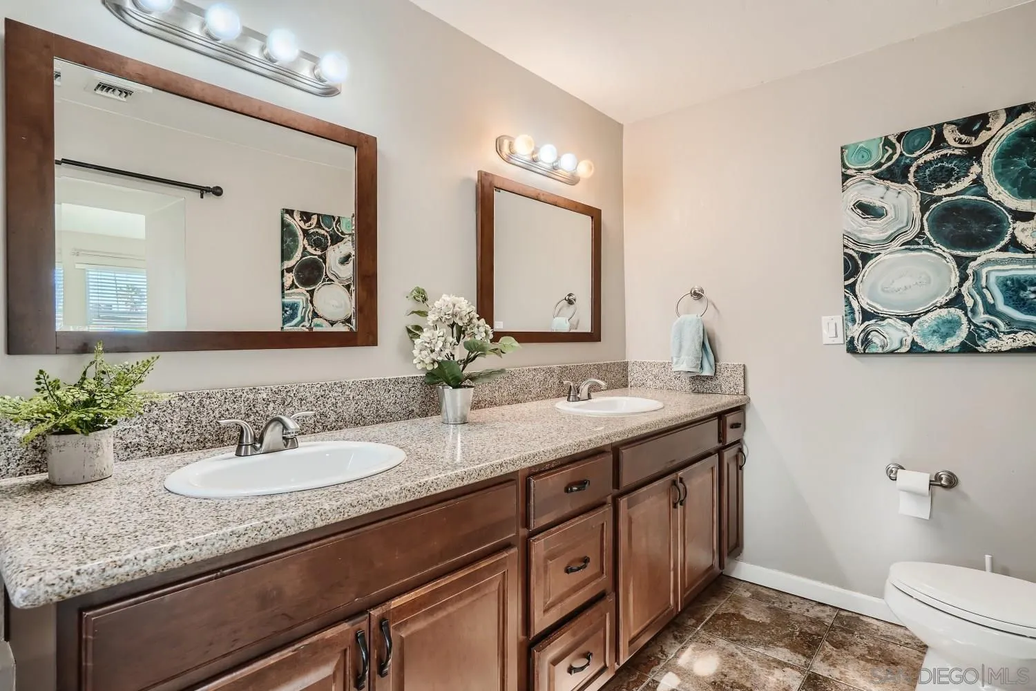 4817 Maple Avenue La Mesa, CA 91942 - Photo 21 of 31 a bathroom with a granite countertop sink and a mirror