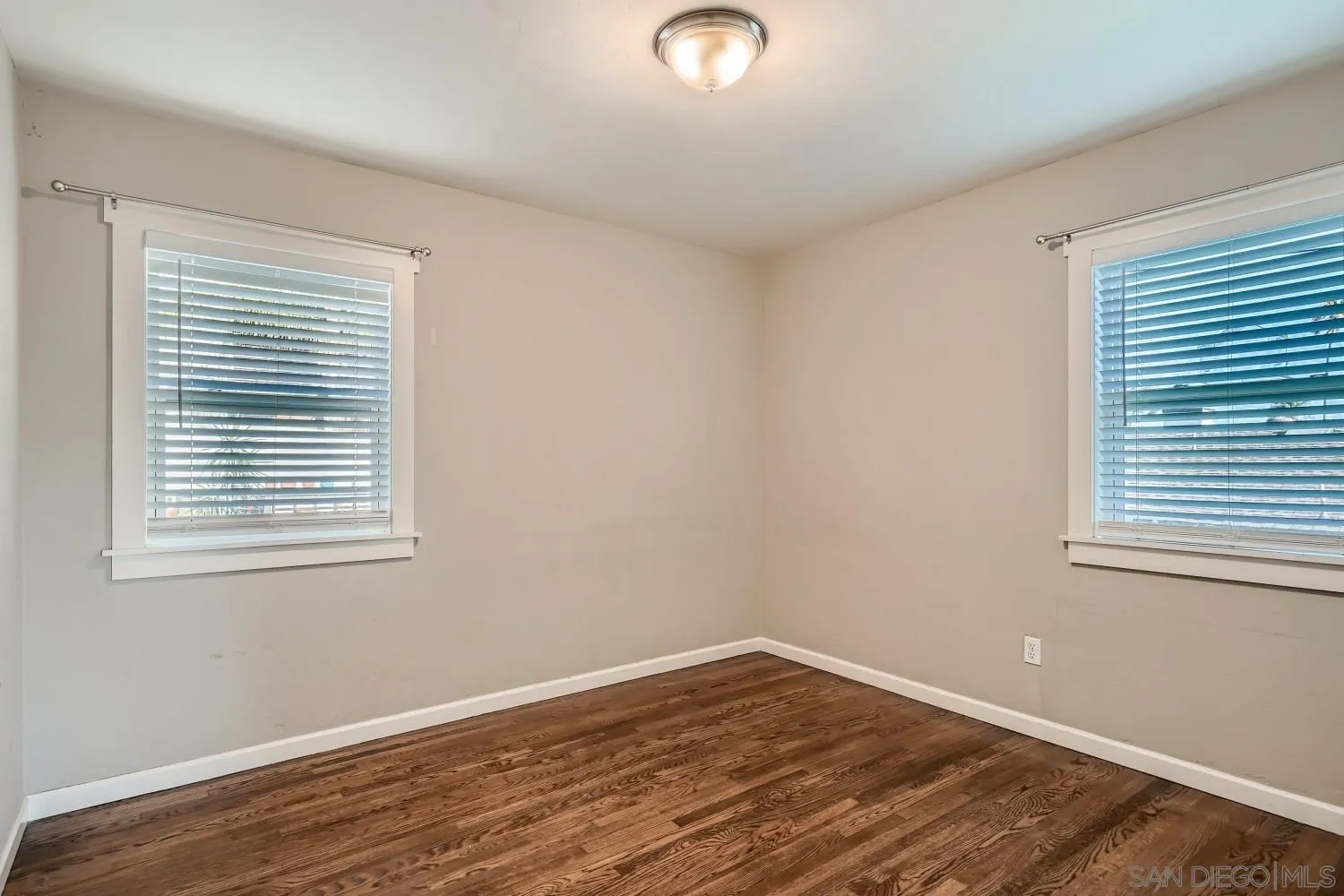4817 Maple Avenue La Mesa, CA 91942 - Photo 22 of 31 a view of an empty room with wooden floor and a window