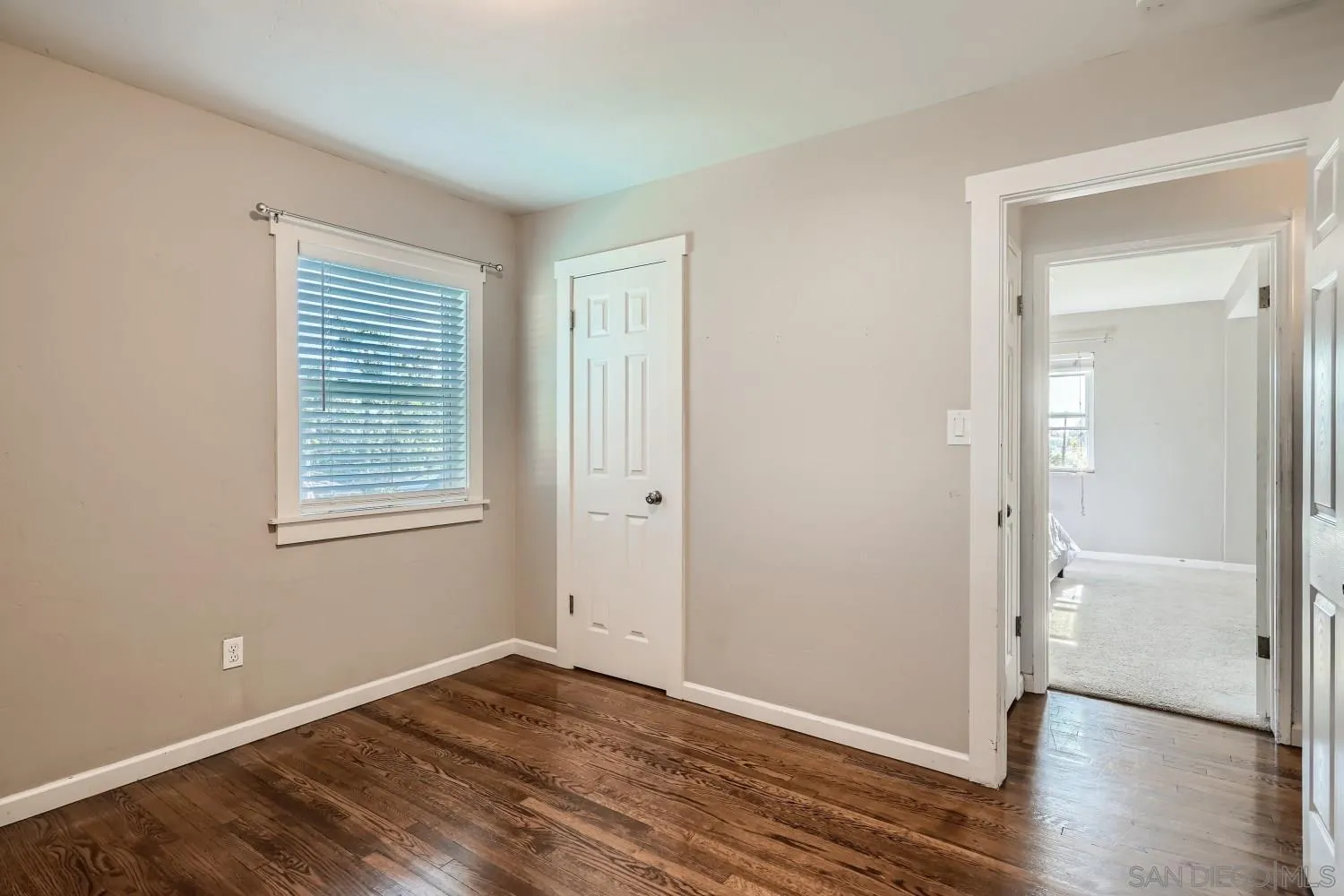4817 Maple Avenue La Mesa, CA 91942 - Photo 23 of 31 a view of an empty room with wooden floor and a window