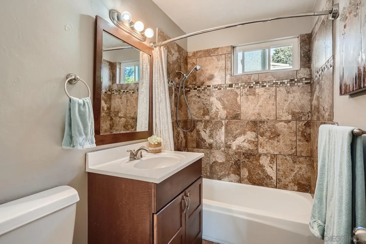 4817 Maple Avenue La Mesa, CA 91942 - Photo 24 of 31 a bathroom with a sink a toilet and shower