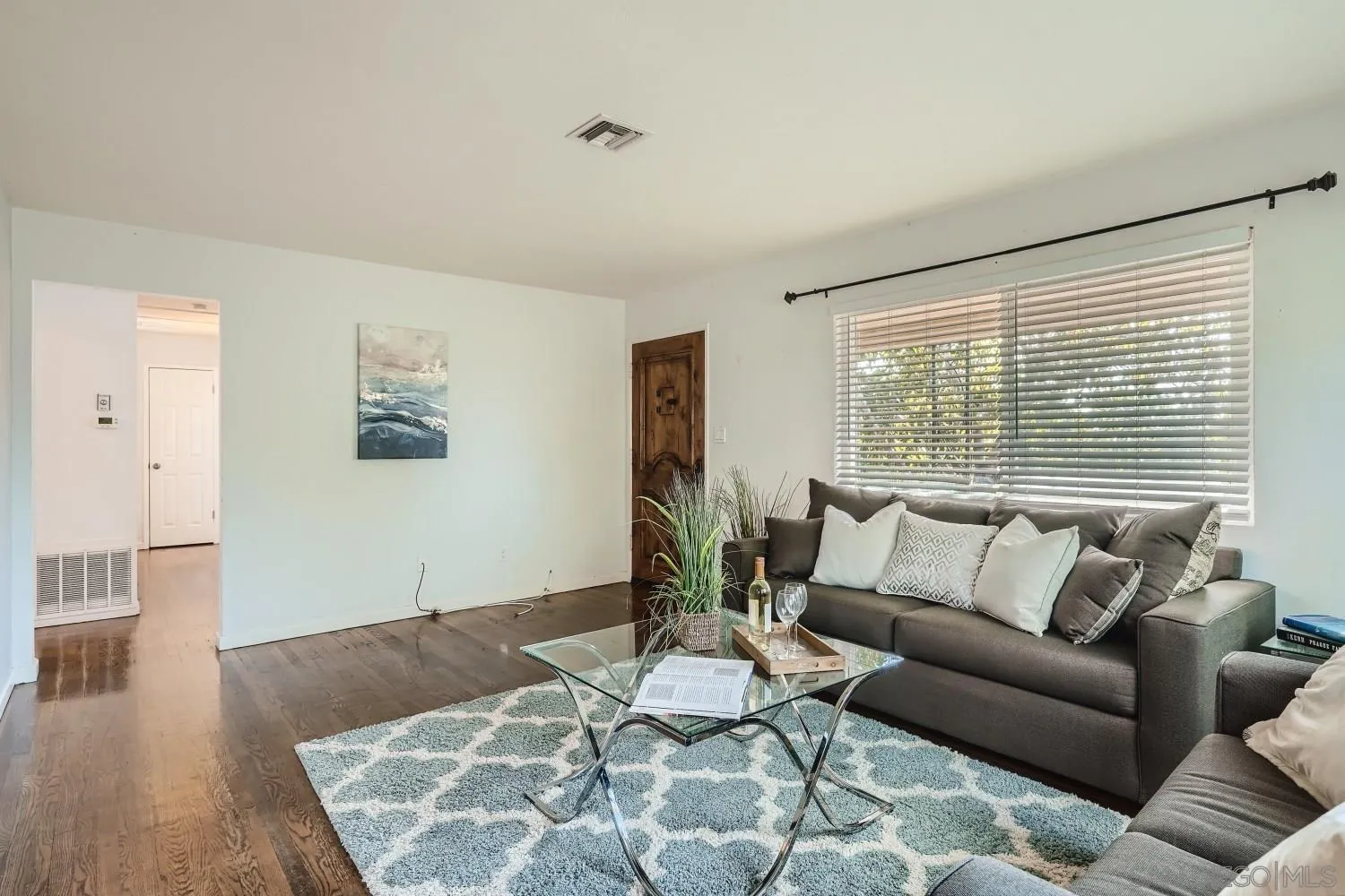 4817 Maple Avenue La Mesa, CA 91942 - Photo 9 of 31 a living room with furniture and wooden floor